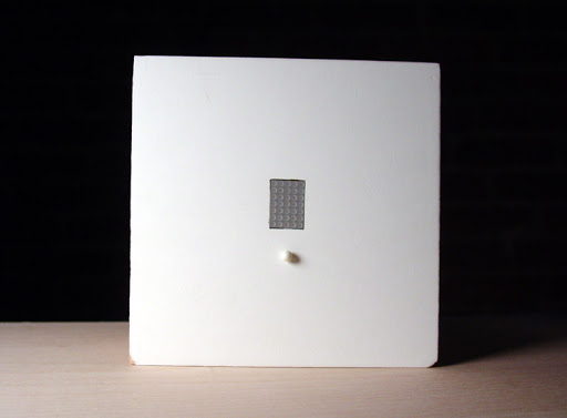 This white square is a section of a wall. This white square is a section of a wall.